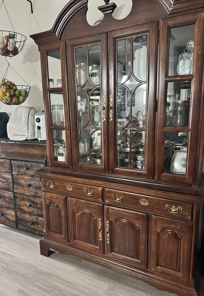 Repurpose an old China cabinet into a cozy apothecary cabinet to hold spices, teas, and dried herbs.